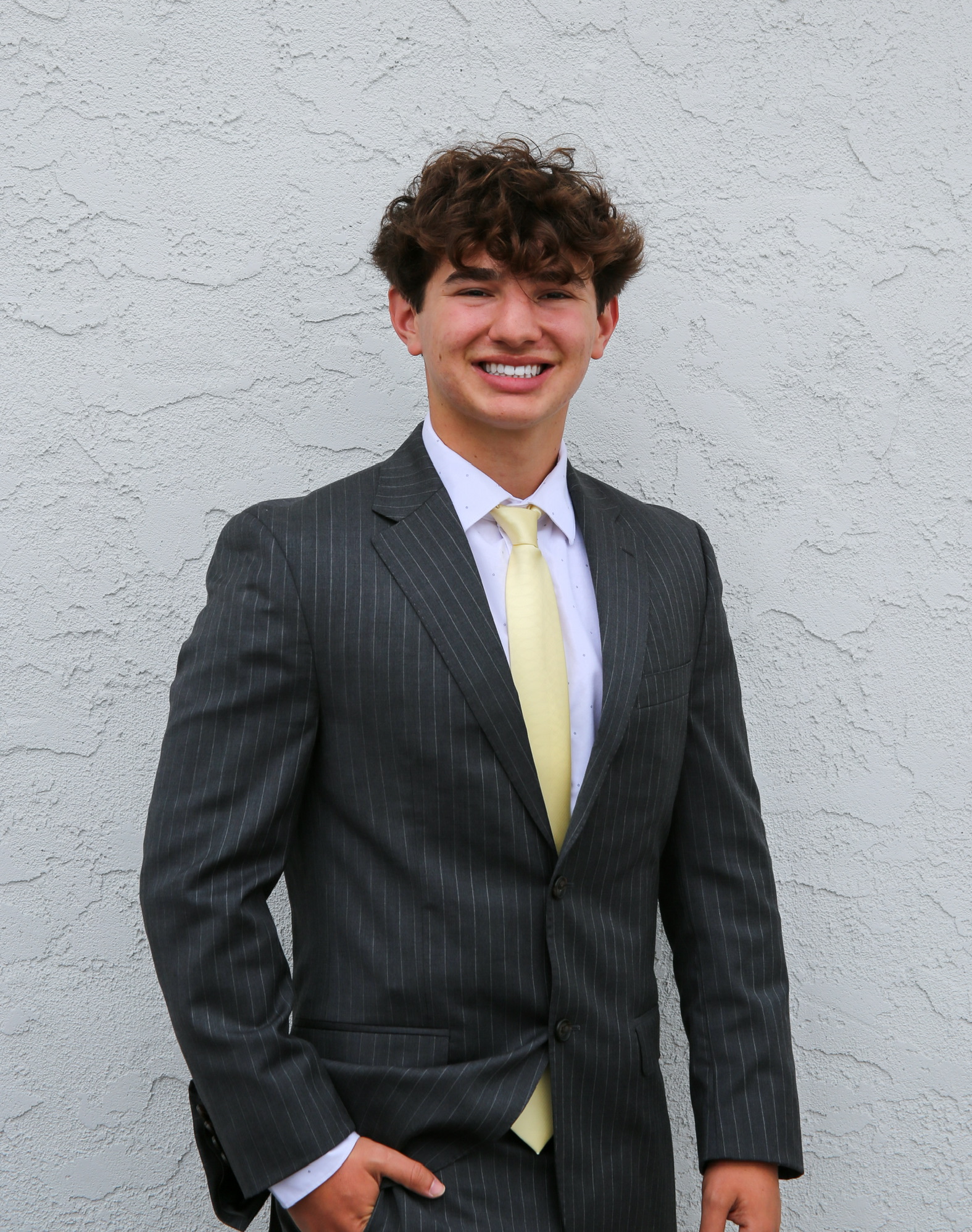 Maxwell Keller, San Diego business operator, in a charcoal pinstripe suit and pale yellow tie